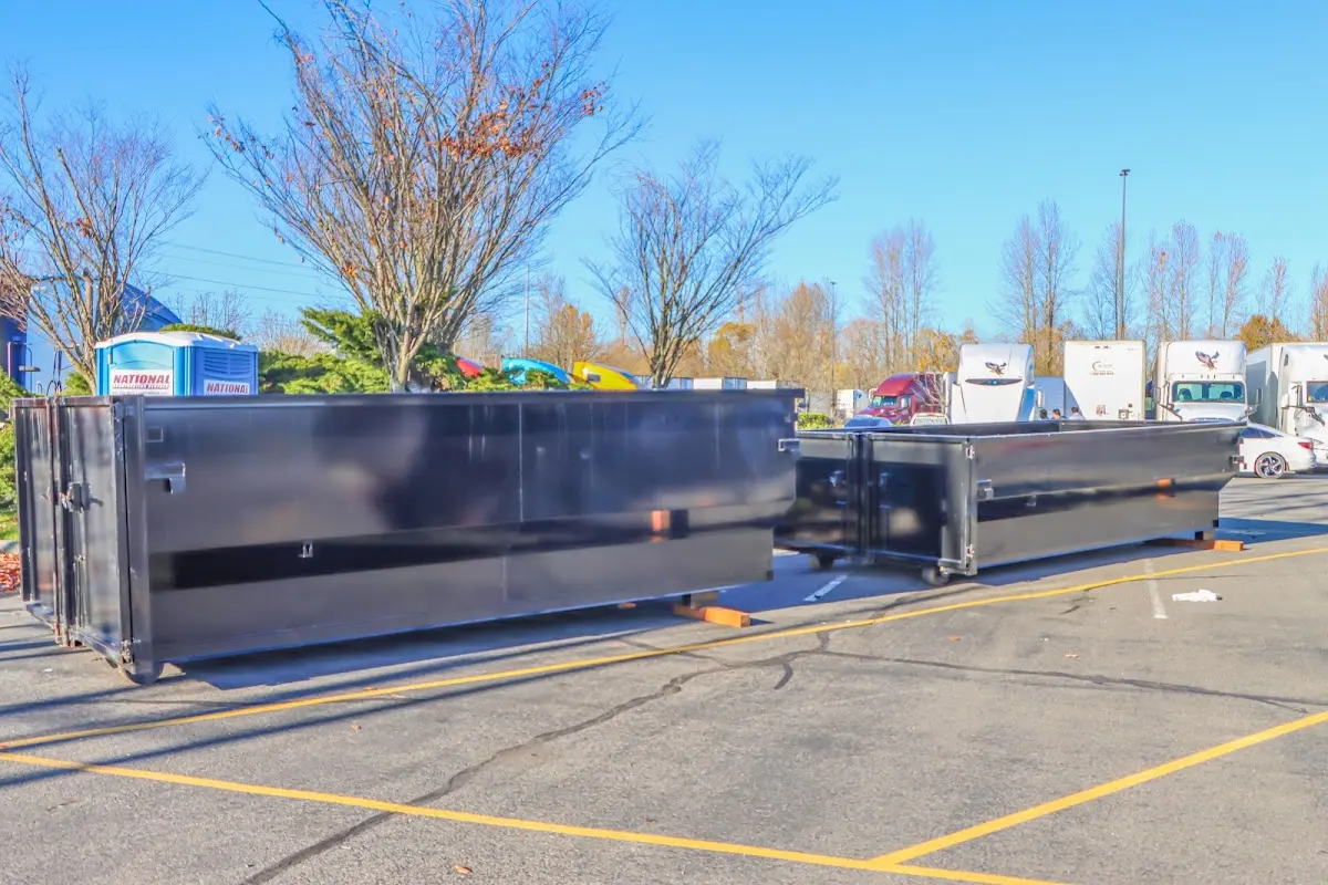 Professional dumpster rental service with roll-off container on residential driveway in Chanhassen